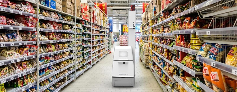 A robot is picking up items at a dark store