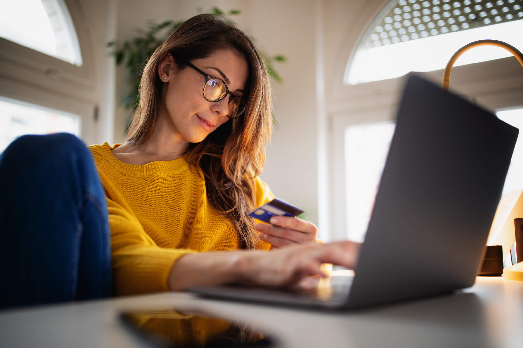 A woman pre-authorizes a card online